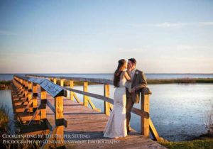 Happy couple at The Whalehead Club waterfront dock