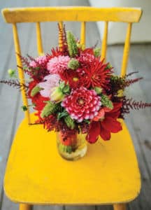flower bouquet displayed on yellow charir