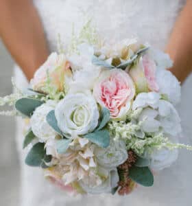 women holding bouquet