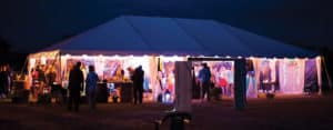 wedding tent lit up at night