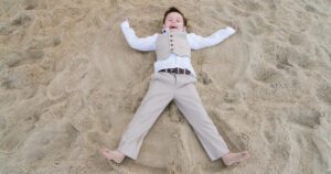 outer banks wedding kid sand angel