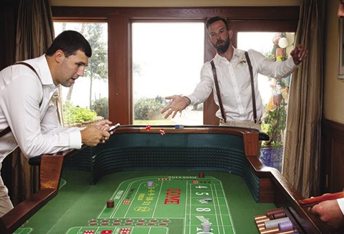 outer banks wedding guide grooms playing craps